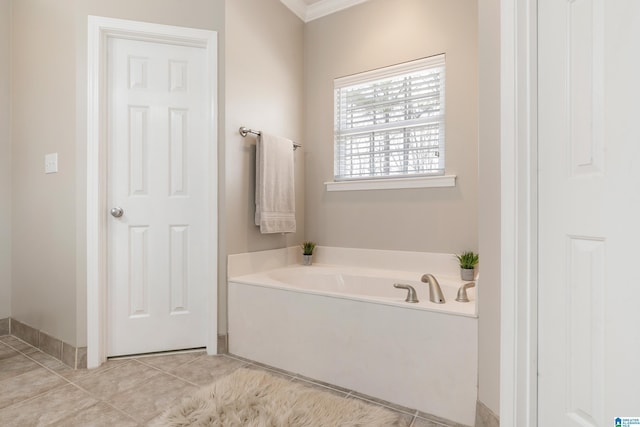 bathroom with a bath and tile patterned floors