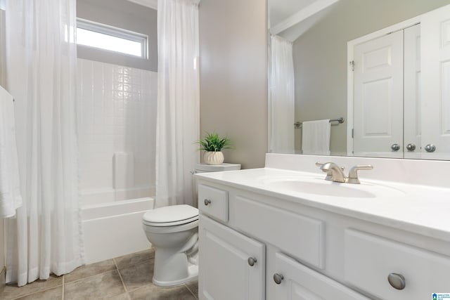 full bathroom featuring shower / bath combo with shower curtain, vanity, tile patterned flooring, and toilet