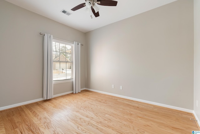 empty room featuring light wood-type flooring and ceiling fan