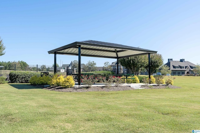 view of property's community featuring a yard and a gazebo