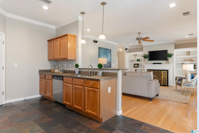 kitchen featuring kitchen peninsula, sink, stainless steel dishwasher, dark stone counters, and crown molding