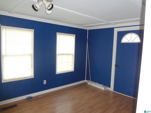 unfurnished room featuring hardwood / wood-style flooring