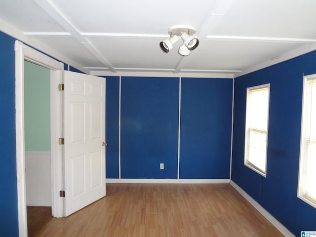 unfurnished room with hardwood / wood-style floors