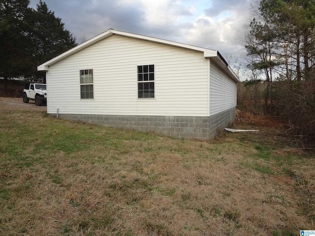 view of home's exterior featuring a lawn