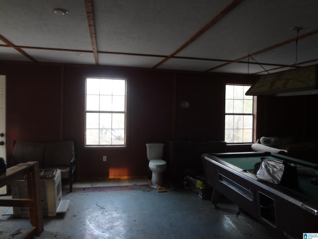 misc room with concrete flooring