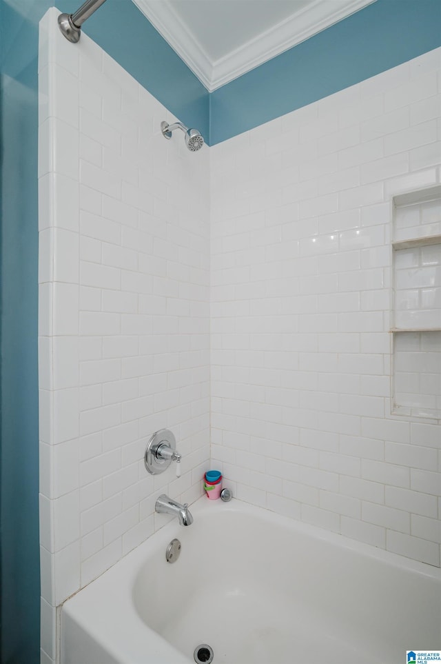 bathroom with shower / washtub combination and crown molding