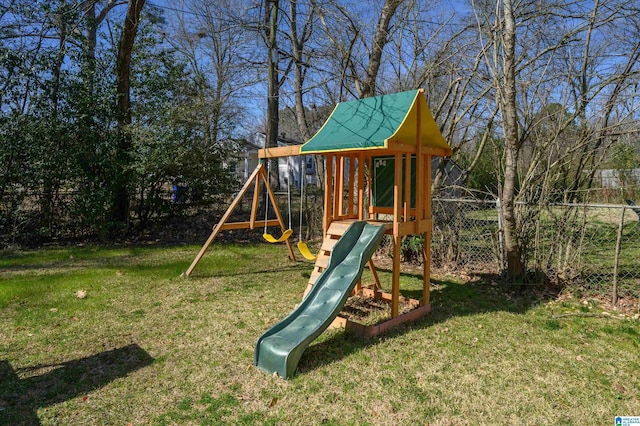 view of play area featuring a yard and fence