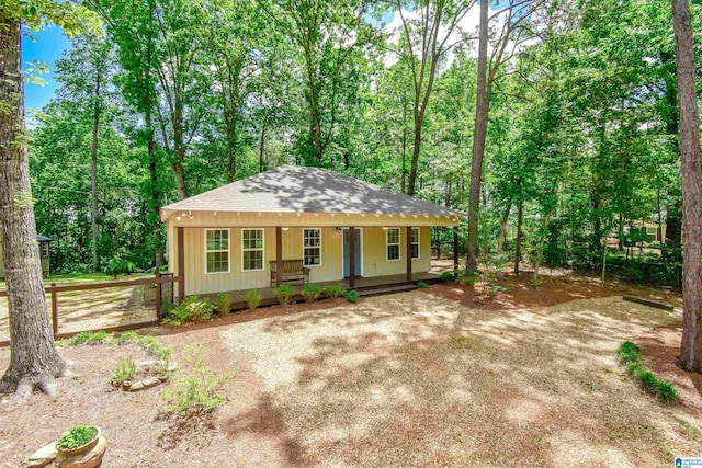 view of front of house featuring covered porch and roof with shingles