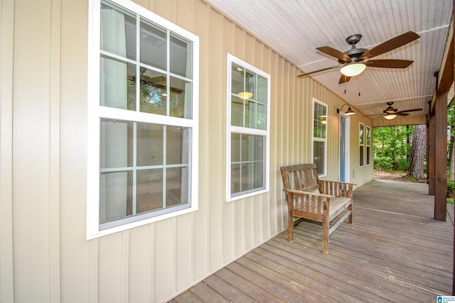 deck with a ceiling fan and a porch