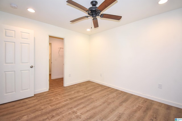 unfurnished bedroom with light wood-style flooring, baseboards, recessed lighting, and a ceiling fan