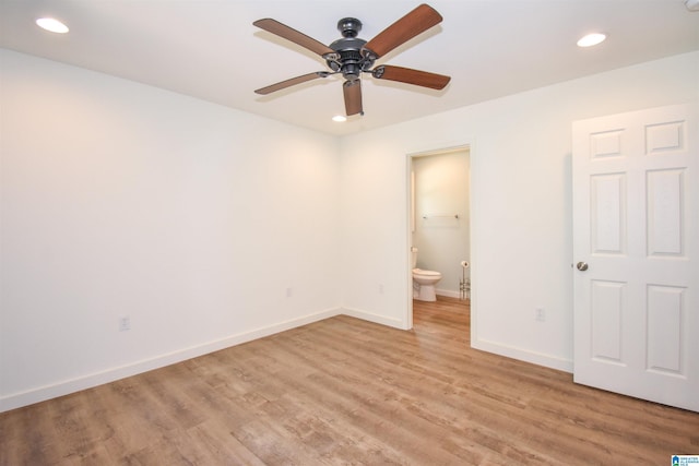 unfurnished bedroom with recessed lighting, light wood finished floors, baseboards, ensuite bath, and ceiling fan
