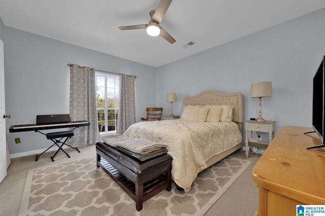 bedroom featuring baseboards, visible vents, a ceiling fan, and light colored carpet