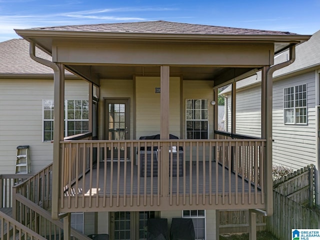 wooden deck featuring fence