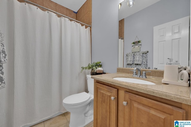 full bathroom with vanity, toilet, and tile patterned floors