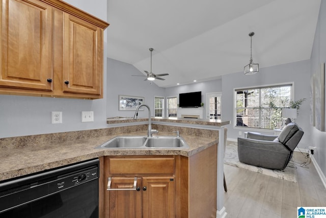 kitchen with lofted ceiling, a sink, black dishwasher, light countertops, and open floor plan