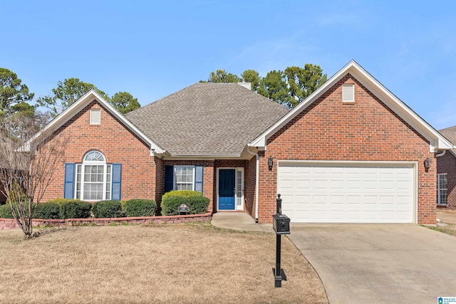 view of property featuring a front yard and a garage