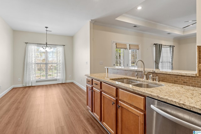 kitchen with sink, stainless steel dishwasher, light stone counters, and light hardwood / wood-style floors