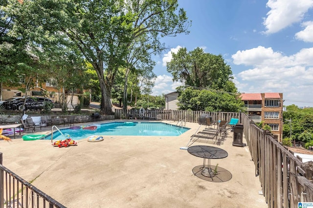 view of pool featuring a patio area