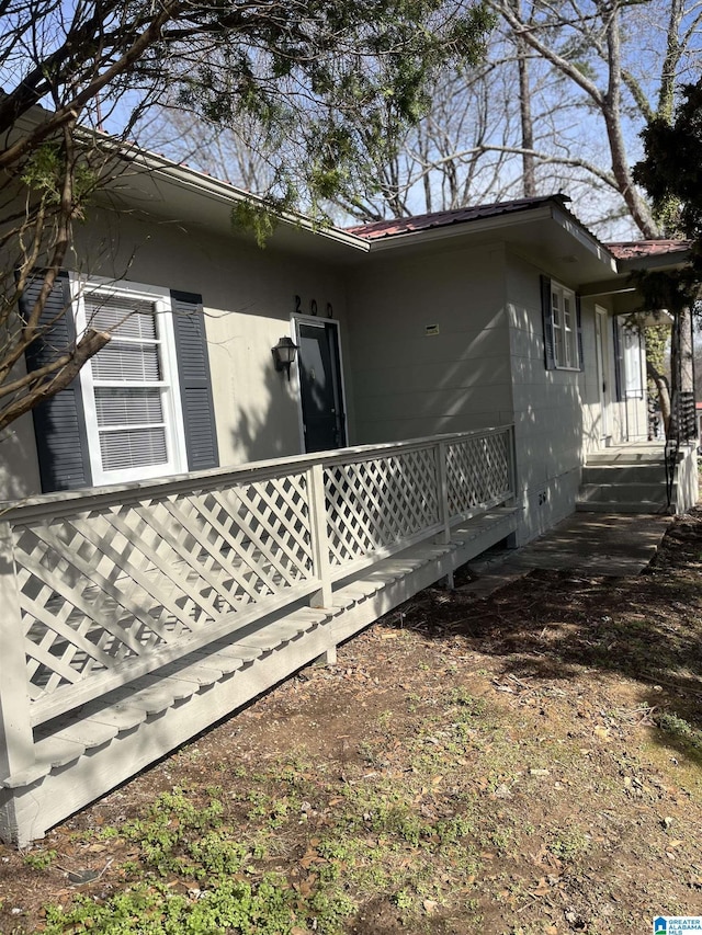 view of home's exterior featuring metal roof