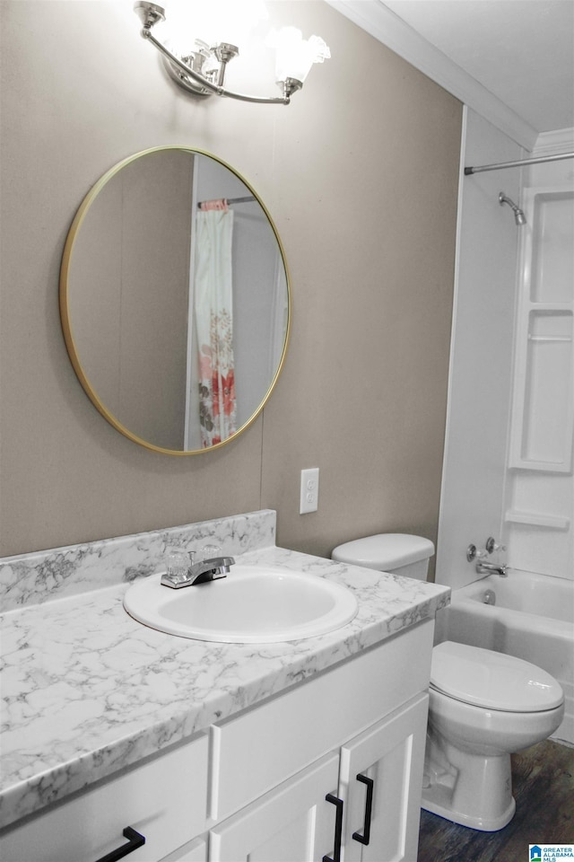 bathroom with toilet, wood finished floors, shower / bathtub combination with curtain, crown molding, and vanity