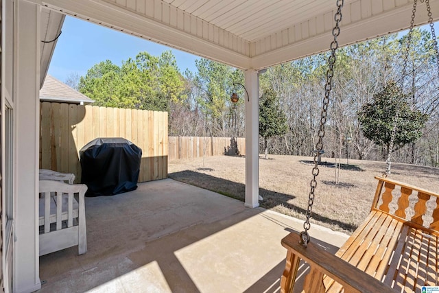 view of patio / terrace with grilling area and a fenced backyard