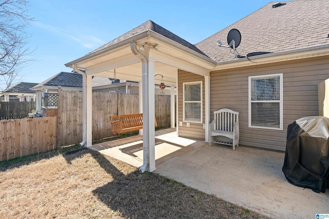 view of patio / terrace featuring fence and grilling area