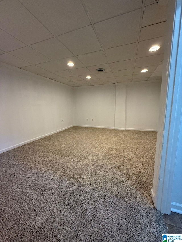 finished basement featuring carpet floors, recessed lighting, a paneled ceiling, and baseboards