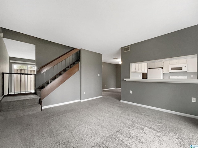 unfurnished living room with carpet floors