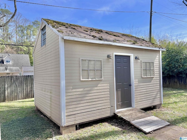 view of outbuilding with a lawn