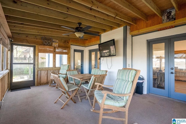 sunroom / solarium with french doors and a ceiling fan