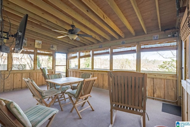 sunroom / solarium featuring lofted ceiling and a ceiling fan