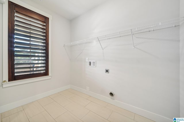 clothes washing area featuring hookup for a washing machine and hookup for an electric dryer