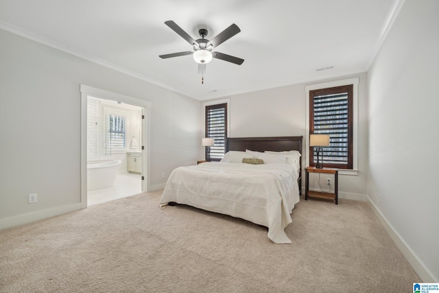 bedroom featuring ceiling fan, crown molding, light carpet, and connected bathroom