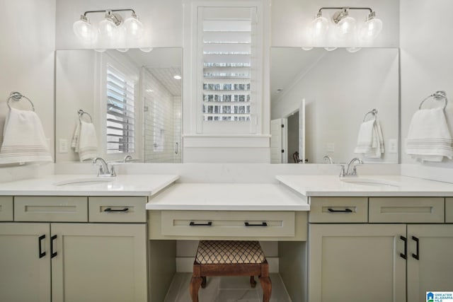 bathroom with ornamental molding, vanity, and a shower with shower door