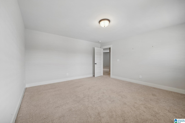 unfurnished room featuring carpet