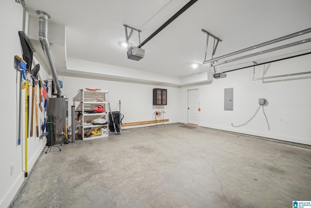 garage with a garage door opener and electric panel