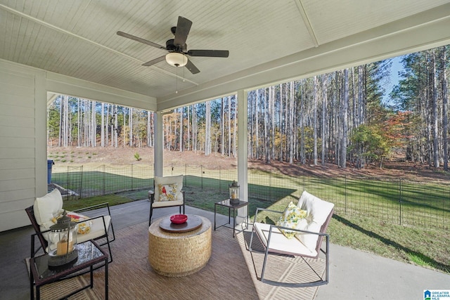 sunroom featuring wooden ceiling and ceiling fan