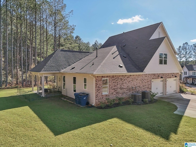 view of property exterior with central AC unit, a garage, and a lawn