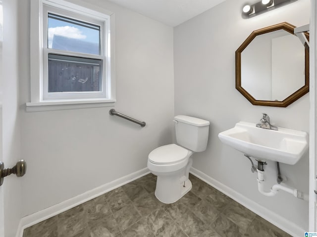 bathroom with sink and toilet