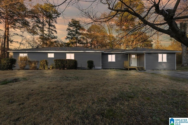 ranch-style house with a yard