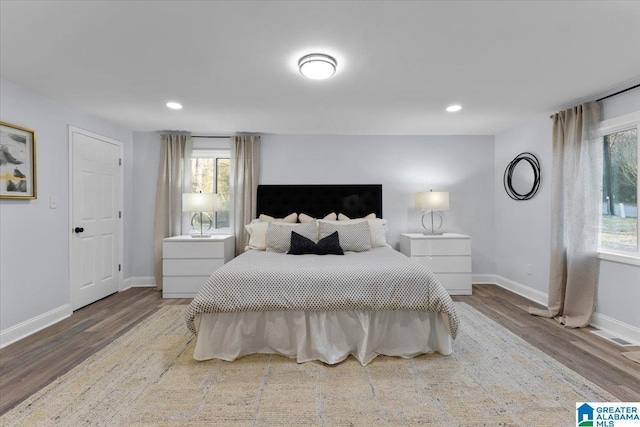 bedroom with hardwood / wood-style floors