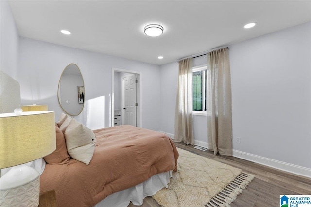 bedroom with wood-type flooring