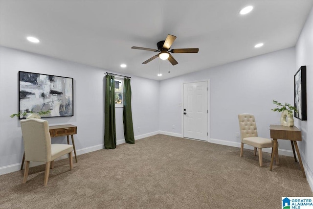 living area featuring ceiling fan and carpet flooring