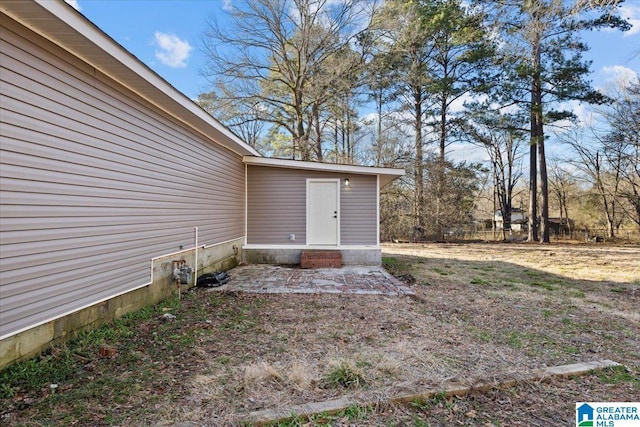 entrance to property with a patio area