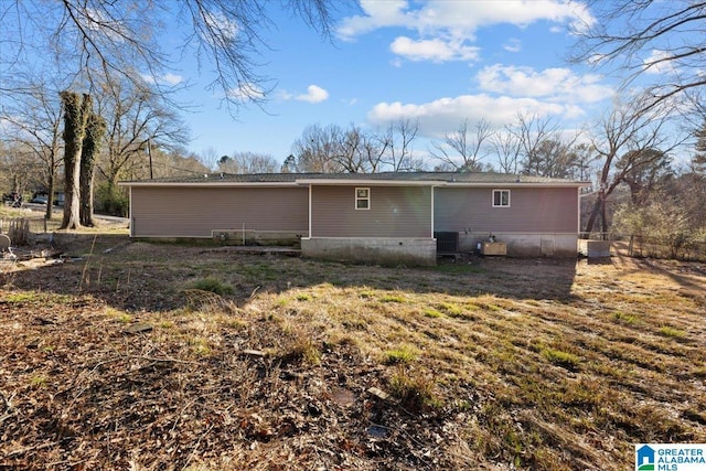 rear view of property featuring central AC unit