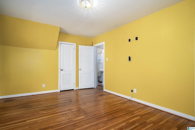 unfurnished bedroom featuring hardwood / wood-style flooring and a closet