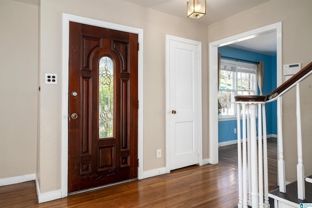 entrance foyer with dark hardwood / wood-style flooring