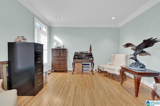 living area featuring ornamental molding, recessed lighting, light wood-style floors, and baseboards