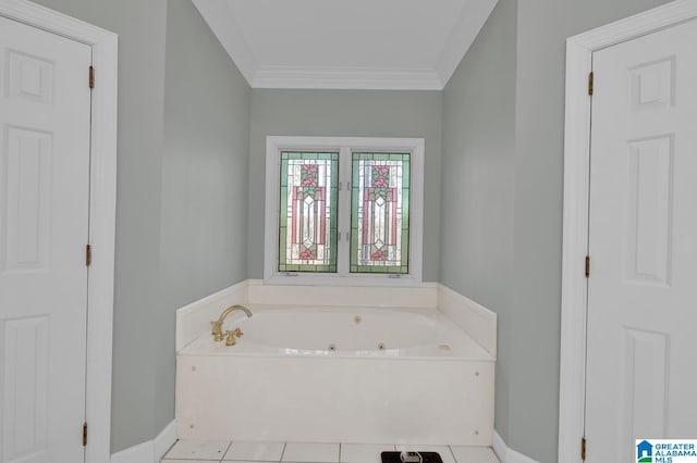 bathroom featuring ornamental molding, a tub with jets, and baseboards