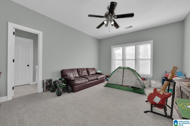 recreation room with carpet flooring, visible vents, and a ceiling fan